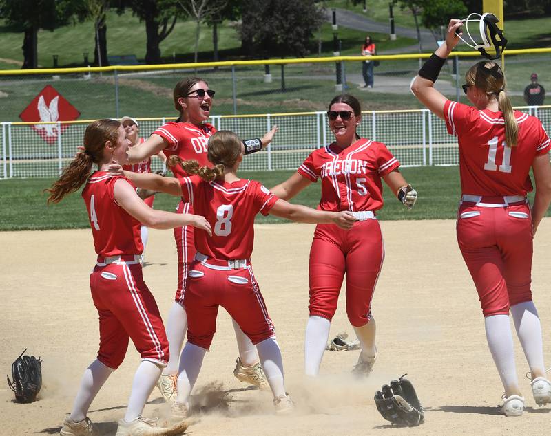 Oregon players celebrate after the final out to beat Rock Falls 8-0 in the championship game of the 2A Oregon Regional on Saturday, May 23, 2026 at Oregon Park West.