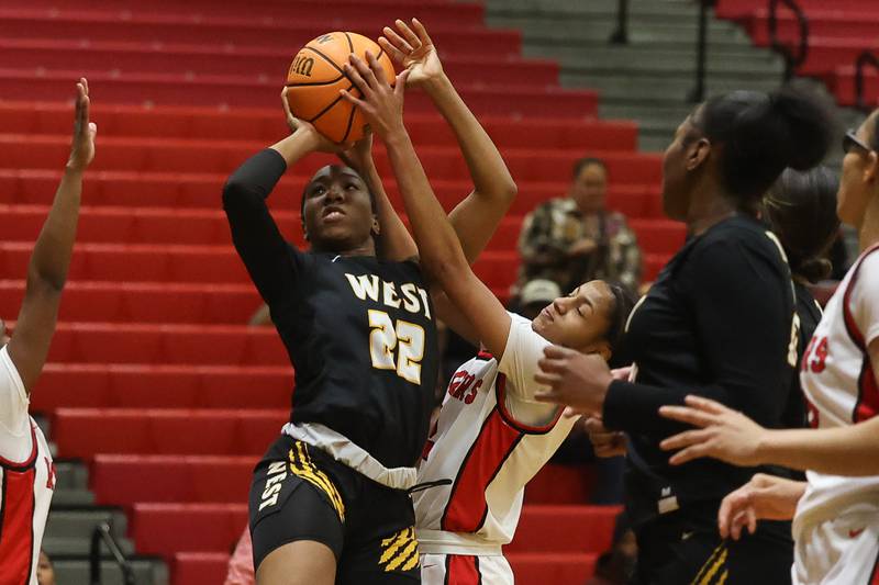 Bolingbrook’s Kennedy Williams blocks a shot by Joliet West’s Makayla Chism on Thursday, Jan 23, 2025 in Bolingbrook.