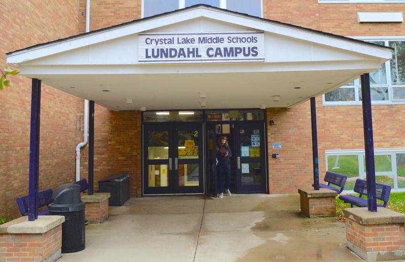 Lundahl Middle School Principal Angie Compere opens an entrance at Lundahl Middle School in Crystal Lake to speak to a photographer Lundahl Middle School is seen Monday, Oct. 19, 2020.