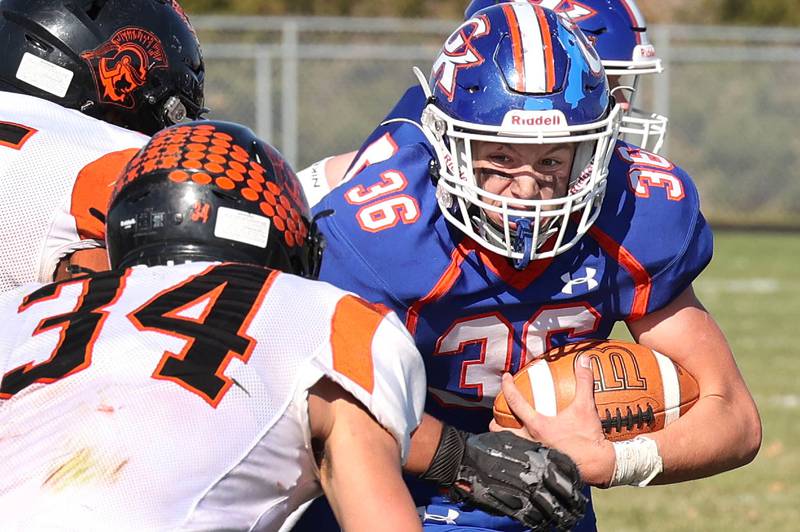 Genoa-Kingston's Brady Brewick prepares for contact with Elmwood’s Slone Windish during their first round playoff game Saturday, Oct. 29, 2022, at Genoa-Kingston High School.