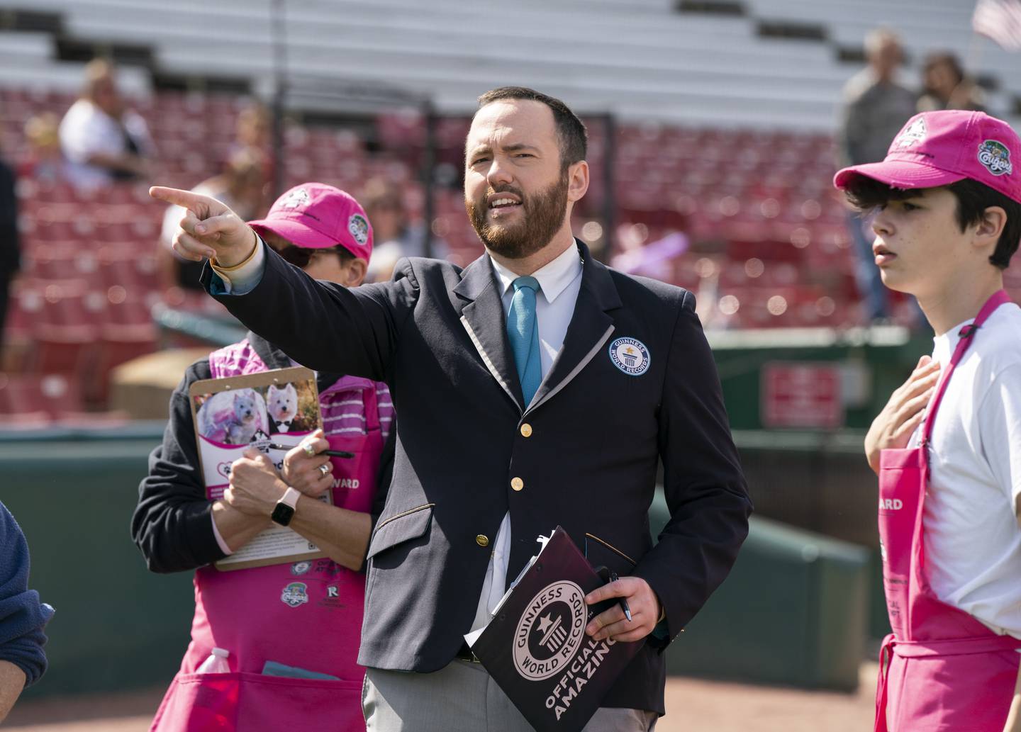 Mike Marcotte, an adjudicator with the Guinness World Records makes his official count during an event to attempt to set a Guinness world record for the largest dog wedding ceremony at the Diamonds in the Ruff event Sunday, October 2, 2022 at Northwestern Medicine Field in Geneva. The charity event needed 178 pairs of dogs to be married to set the new record but unfortunately fell short of that number.
