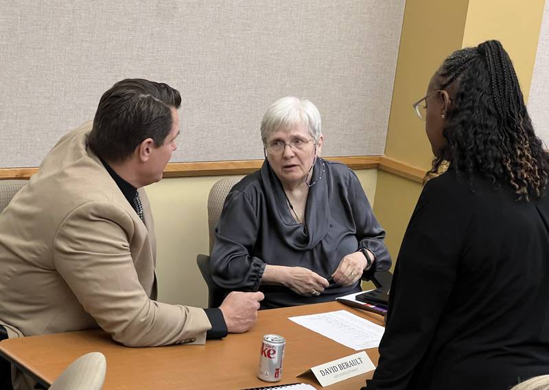 DeKalb County Administrator Brian Gregory, DeKalb County Board Chair Suzanne Willis, a Democrat from District 10, and Rukisha Crawford, a Democrat from District 6, talk after the Sept. 20, 2023 DeKalb County Board meeting.