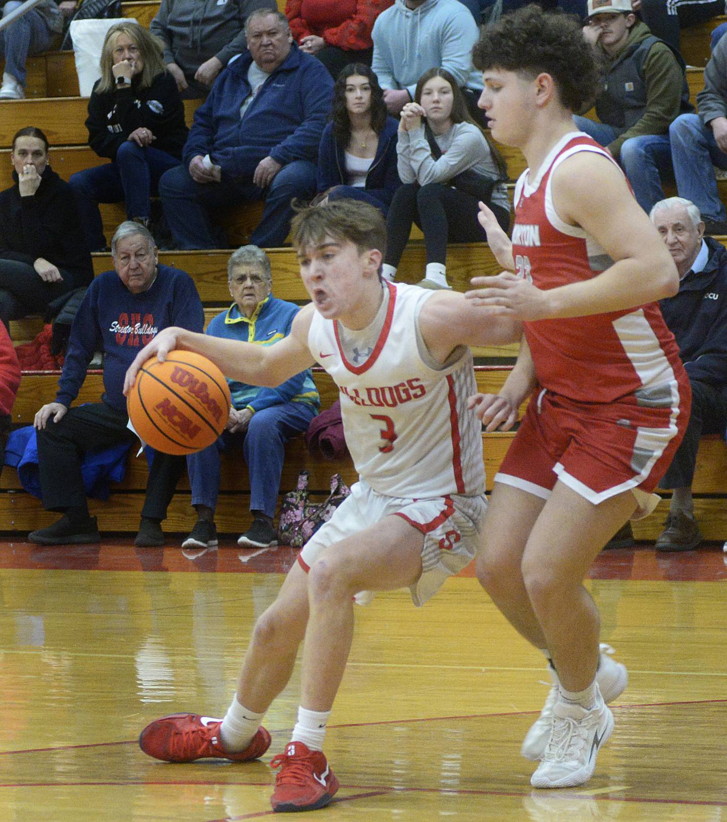 Streator’s Nolan Ketchman (3) works to get past Morton’s Grant Selke on a second-quarter drive to the basket Wednesday, Feb. 19. 2025, in Streator.