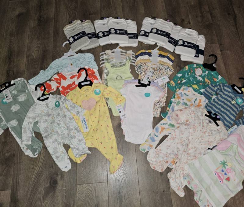 The Council of Catholic Women at St. Dennis Catholic Church in Lockport presented Kristina Lowman of Channahon with a large donation of baby clothes and baby supplies for Lowman's Two Miracle Girlz NICU Sprinkles service project. Through this service project, Lowman assembles and distributes care packages to families with a premature babies.