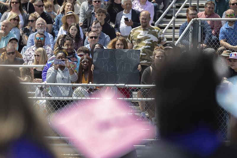 A loved one displays a sign Sunday, May 25, 2025, during Dixon High School’s graduation.