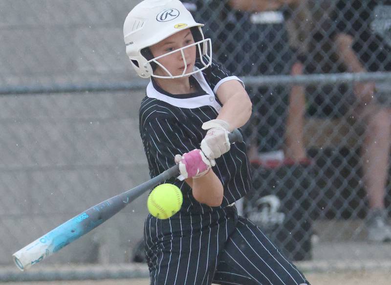 Woodland's Bristol Flowers makes contact with the ball on Tuesday, May 12, 2026 at Woodland High School.