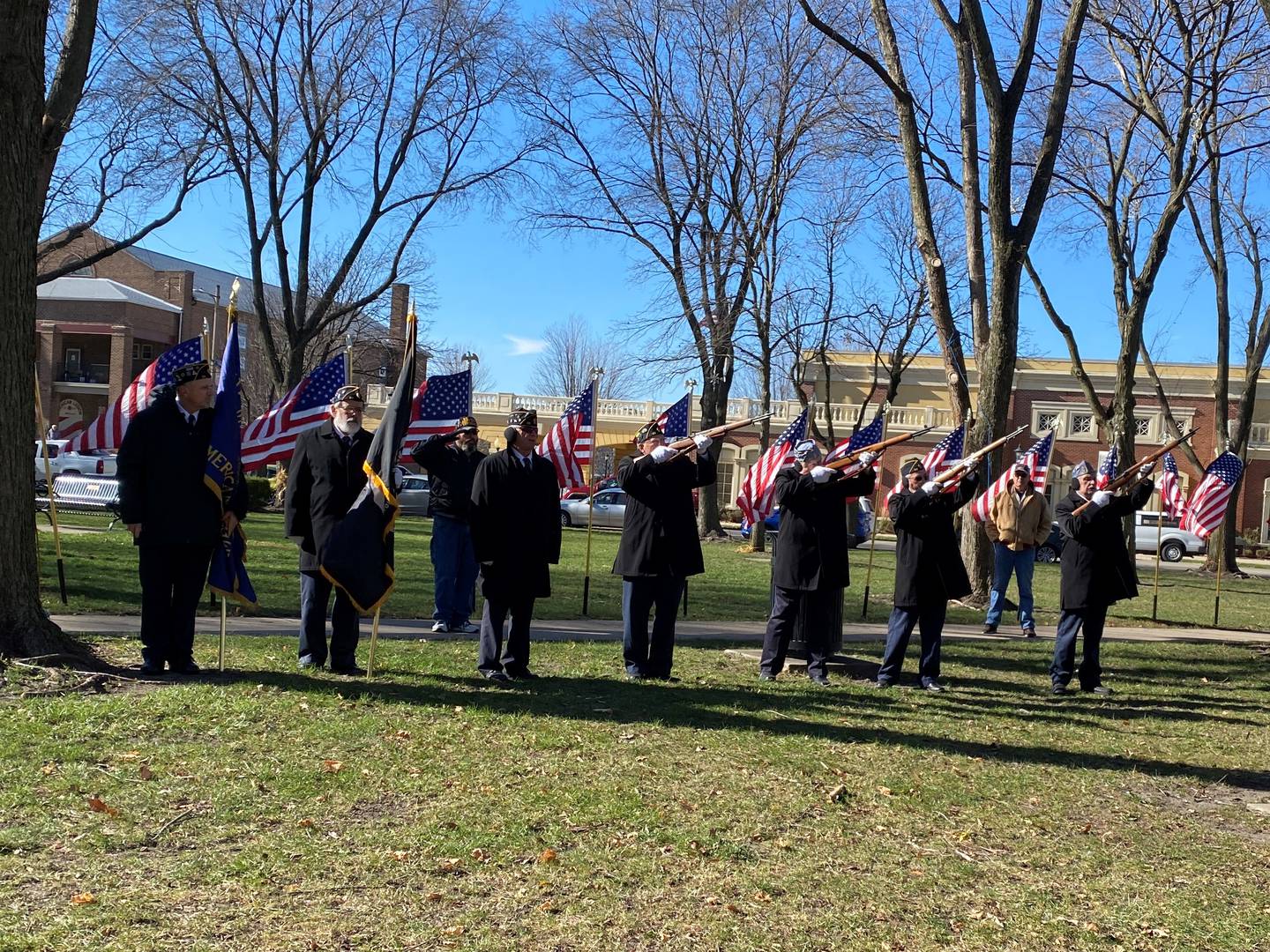 The Firing Squad takes aim and fires as part of their salute.