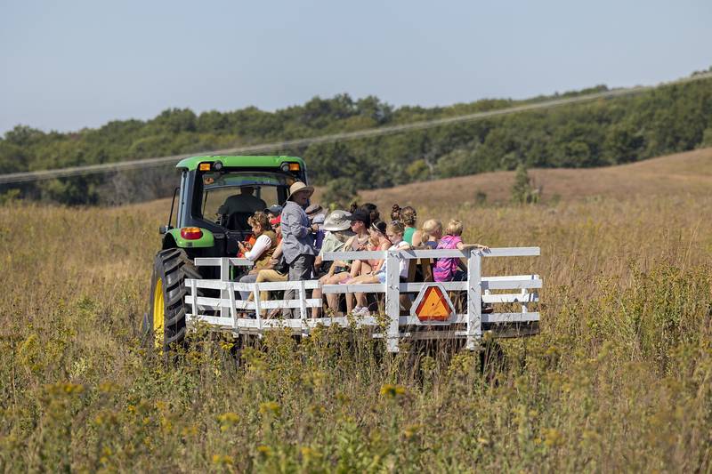 A group of visitors head out to check out the bison Saturday, Sept. 21, 2024, at the Nachusa Grasslands.