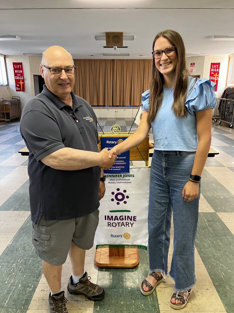 Isabel Heimsoth was selected by the Ottawa Sunrise Rotary Club for its scholarship for the Class of 2023 at Ottawa High School. She will be attending St. Louis University in the fall to study physical therapy. President Rick Scott congratulates Heimsoth on the honor.