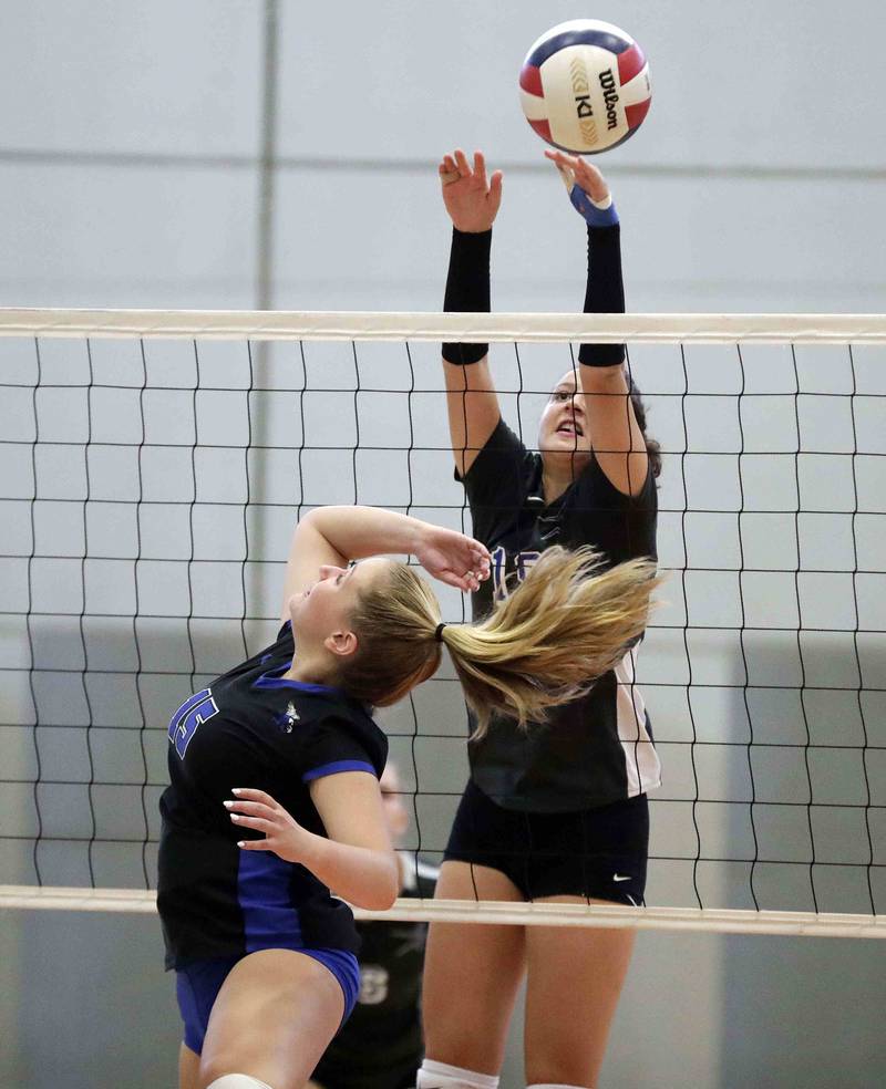 St. Charles North’s Alex Bardouniotis (19) and Lincoln Way East’s Grace Poyton (15) Saturday September 17, 2022 in Wheaton.