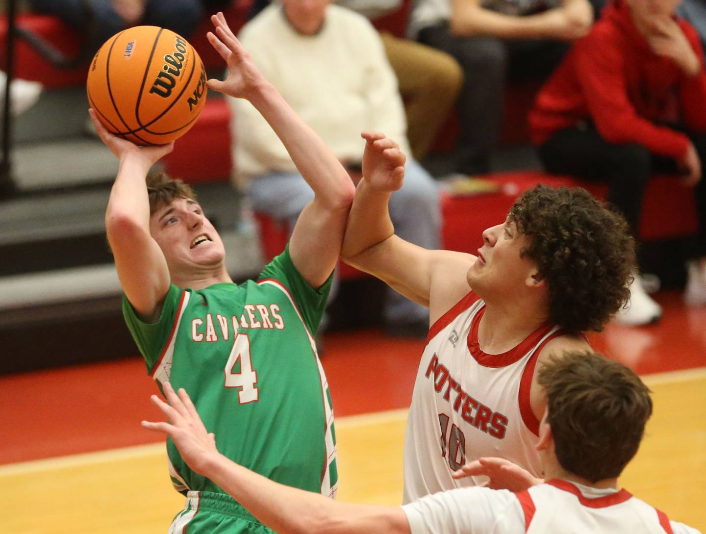 L-P's John Sowers lets go of a shot over Morton's Brendan Petty during the Class 3A Sectional semifinal game on Tuesday, March 3, 2026 in Kingman Gymnasium at Ottawa High School.