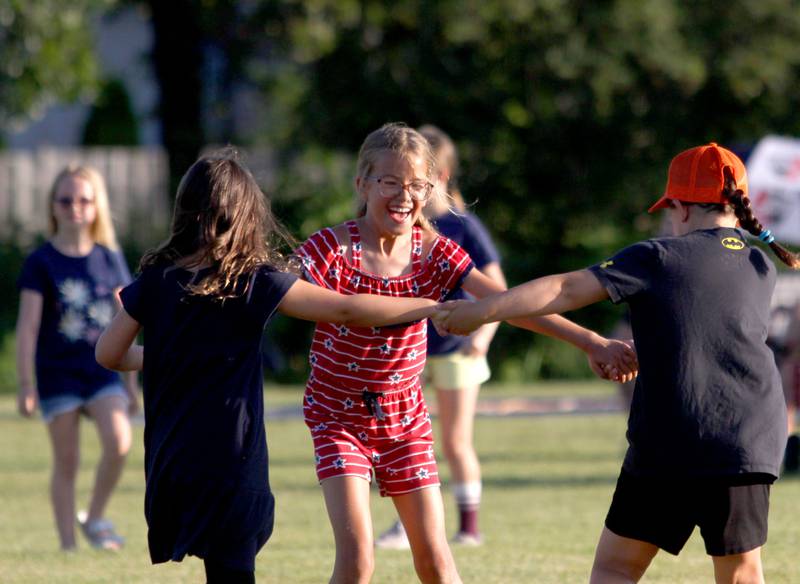 Children dance to the sounds of the Modern Day Romeos during the Stars N’ Stripes Fest at Cary-Grove Park in Cary on Saturday, June 28, 2025.