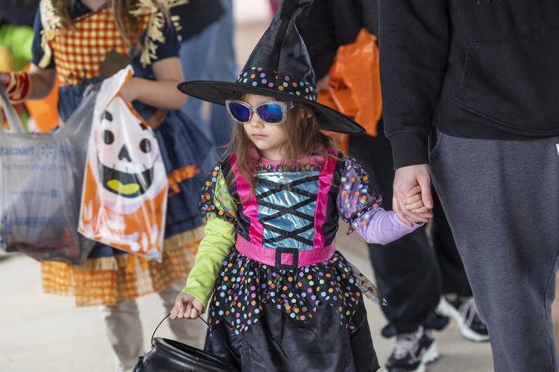 Emma-Grace Miniel, 4, of Sterling, looks for treats Tuesday, Oct. 28, 2025, at Sterling’s trunk-or-treat.