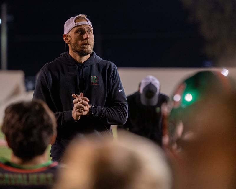 L-P Head Coach JJ Raffelson, talks with team after loss to O' Fallon on Friday, October 24, 2025 at Howard Fellows Stadium in LaSalle.