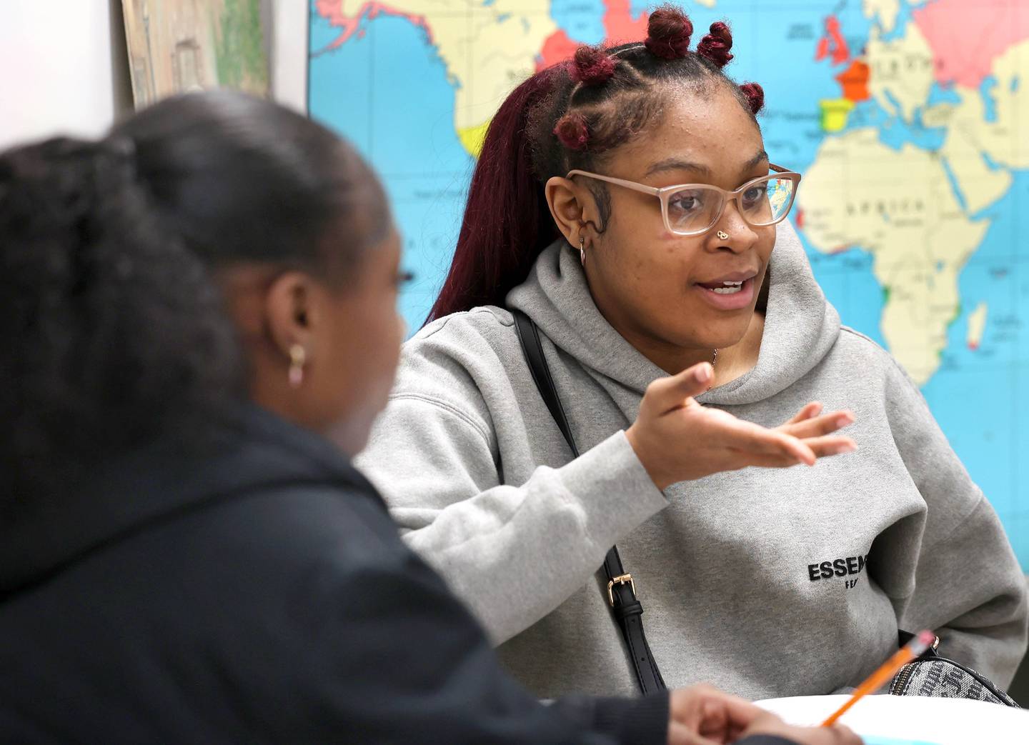 DeKalb High School seniors Me'She Eubanks (left) and Ayanna Kelly talk Tuesday, Feb. 10, 2026, at the school about their AP African American Studies class. This is the first year that the course is available to students at the school.