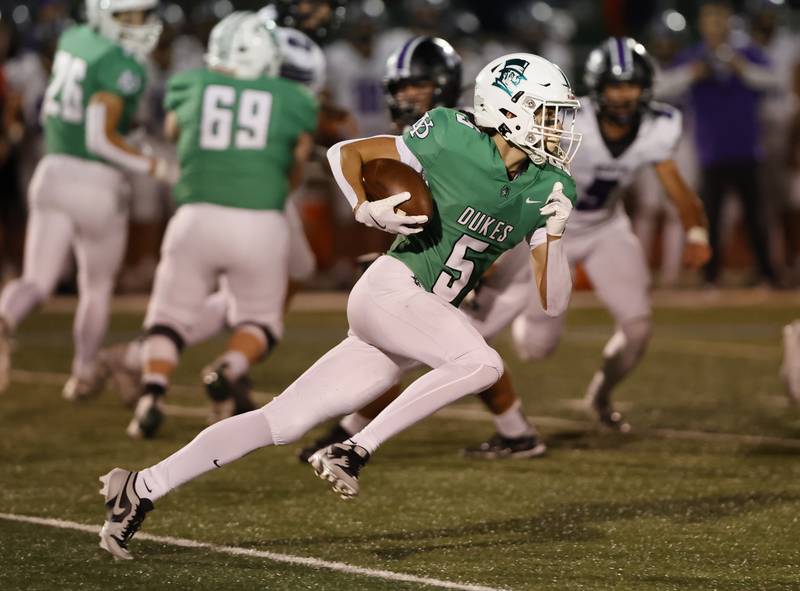 York's Hayden Alexander (5) makes a run during the varsity football game between Downers Grove North and York on Friday, Oct. 4, 2024 in Elmhurst.