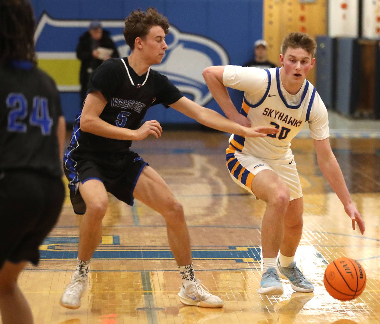 Johnsburg's Jayce Schmitt brings the ball up the court against Woodstock's Max Beard during a Kishwaukee River Conference boys basketball game on Friday, February. 13, 2026, at Johnsburg High School.