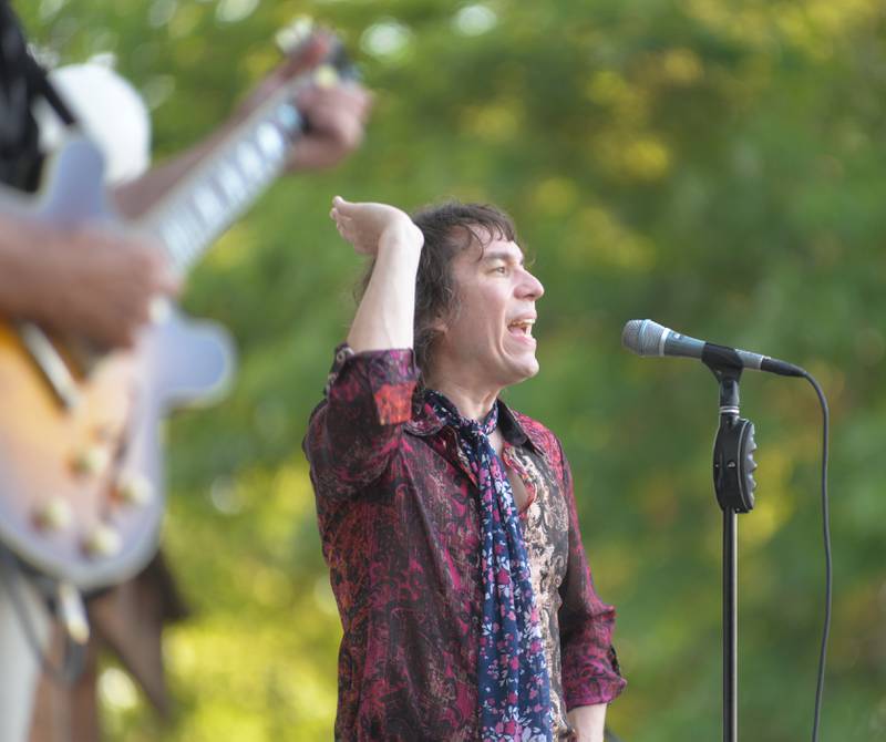 The lead vocalist for the band "Rocks Off" sings with his band as they perform Rolling Stones songs at the Mt. Morris Jamboree on Friday, June 20, 2025. The free evening concerts are held on Fridays through the summer on the Warren Reckmeyer Bandshell on the Campus in downtown Mt. Morris.