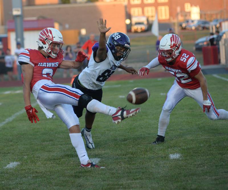 Oregon's Austin Egyed punts the ball as Dixon's Devon Wallace almost gets a piece of it on Friday, Sept. 1, 2023 at Oregon High School's Landers-Loomis Field/