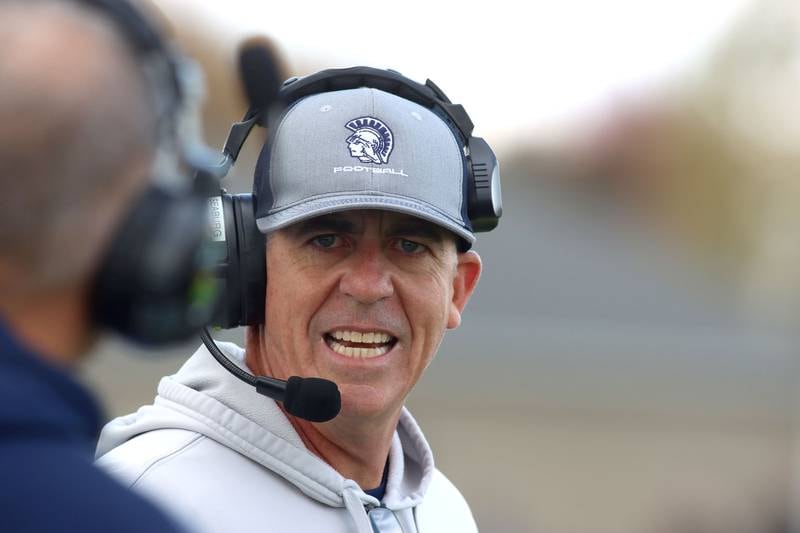 Cary-Grove’s Head Coach Brad Seaburg guides the Trojans against Sycamore in IHSA football Class 5A first-round playoff action at Al Bohrer Field on the campus of Cary-Grove High School in Cary on Saturday, November 1, 2025.