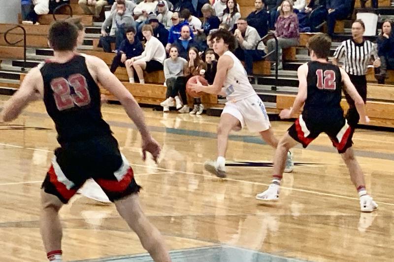 Bureau Valley sophomore Logan Philhower makes a pass across court in the second half of Tuesday's game at the Storm Cellar. The Storm beat Amboy, 60-33.