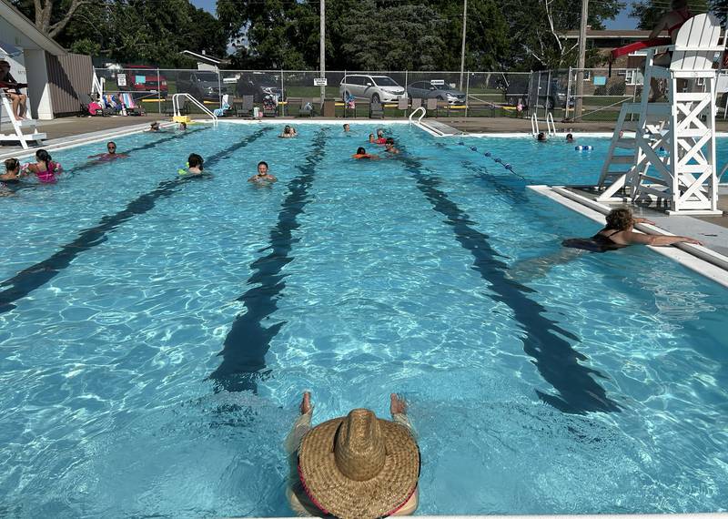 A man rests against a side of the Polo Pool on Monday, July 28., 2025.