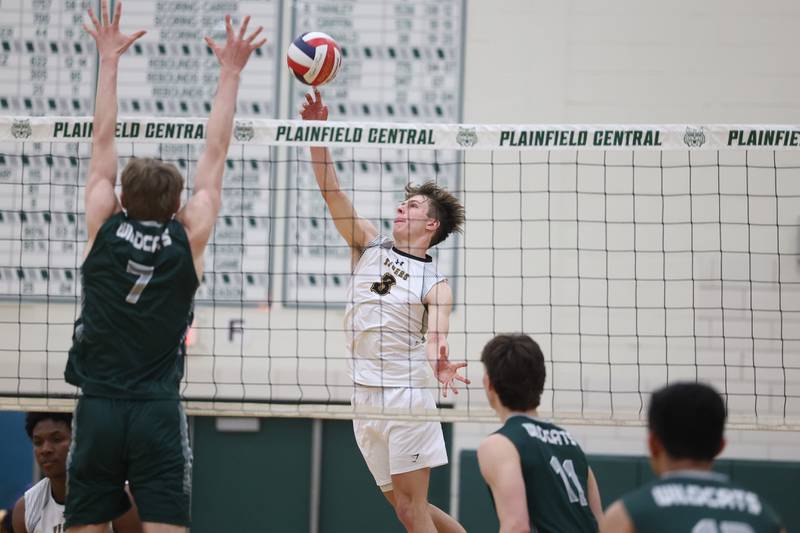 Joliet West’s Nathan Fleischauer flips a shot over the net against Plainfield Central on Tuesday, April 23, 2024 in Plainfield.