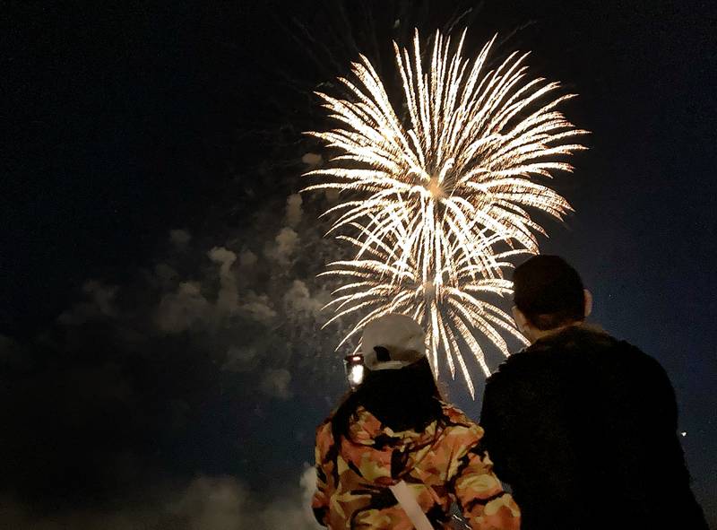 A couple watches the fireworks show on Sunday, July 2, 2023, at Crystal Lake’s Main Beach during Crystal Lake Annual Independence Day Celebration.