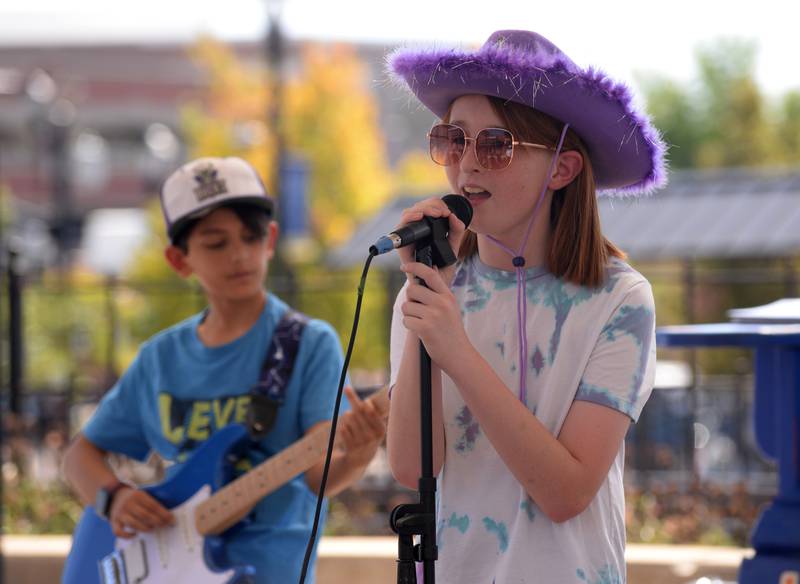 Members of the band Definition of Chaos including Mason Ludford from the Jerry Evans School of Music in Wheaton perform during the Music on Main event held Saturday, Sept. 21, 2024.