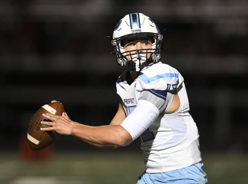Prospect quarterback Brad Vierneisel looks for a receiver against Maine South in a Thursday night football game in Park Ridge on September 15, 2022.