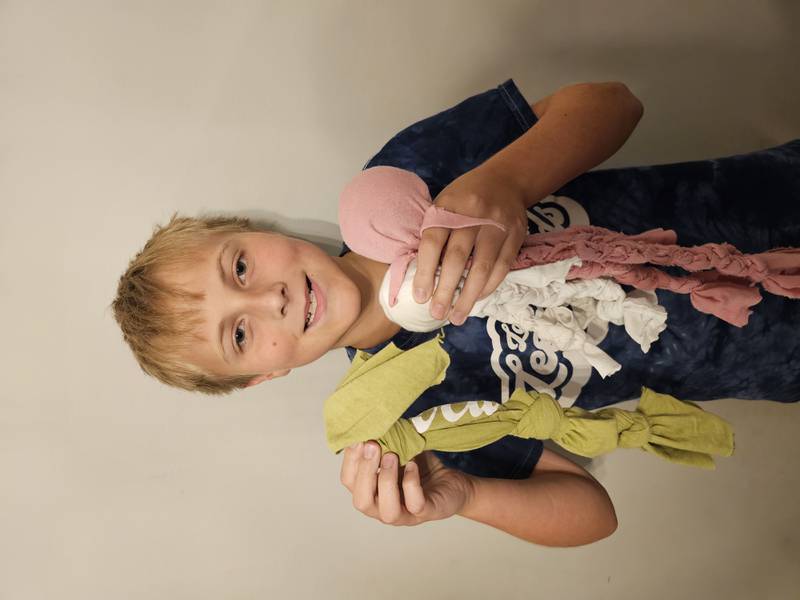 Braeden Cable of Lake in the Hills makes dog toys out of T-shirts and is one of the members of the Huntley chamber's farmers market program for kids.