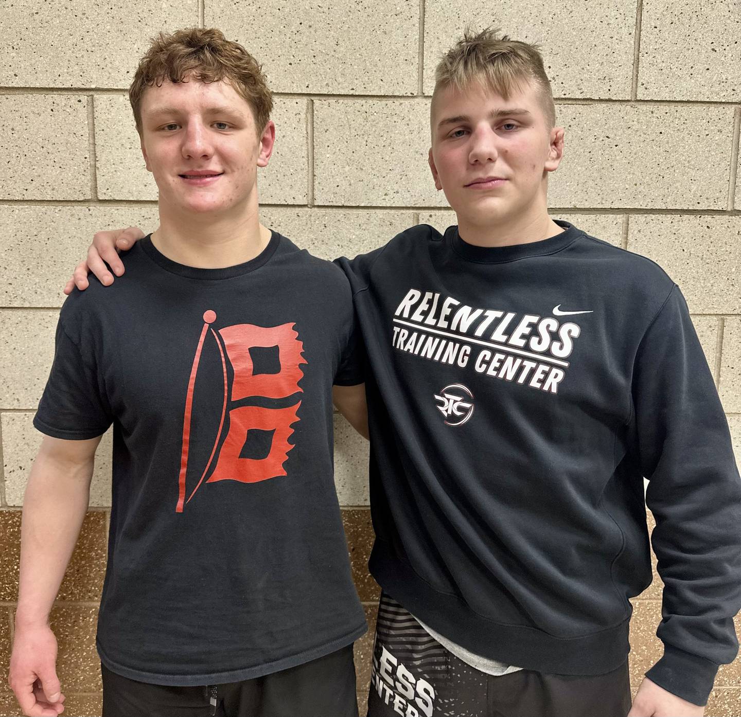 Marian Central's Dan French and Jimmy Mastny (left to right) each earned pins during the team's wrestling match against Joliet Catholic.