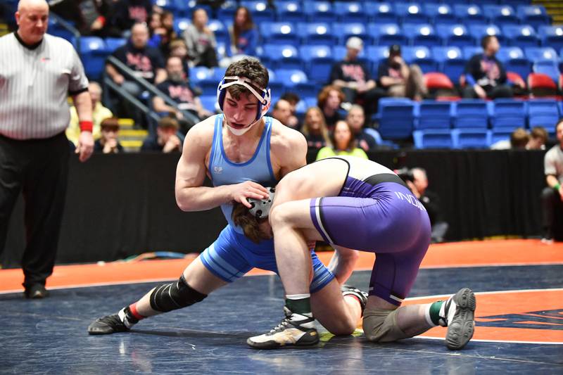 Anthony Haddad of Marmion Academy wrestles Max Haskins of Hononegah in the 165-pound match during the IHSA Dual Team State Finals in Bloomington on Saturday, March 1.