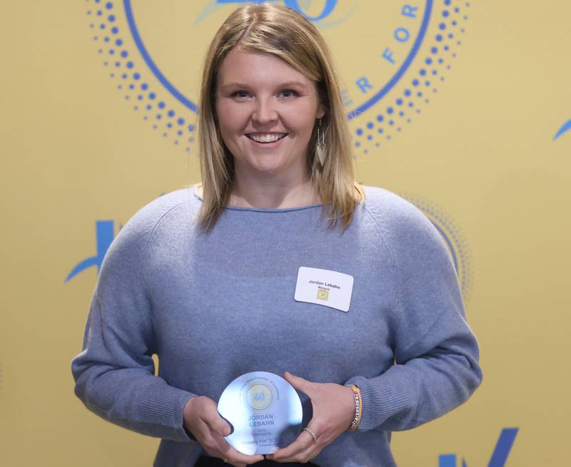 Jordan Lebahn poses with her 40 Under Forty award during the Illinois Valley Chamber of Commerce Champions of Change Awards Night on Wednesday, May 6, 2026 at the Westclox Event Center in Peru.