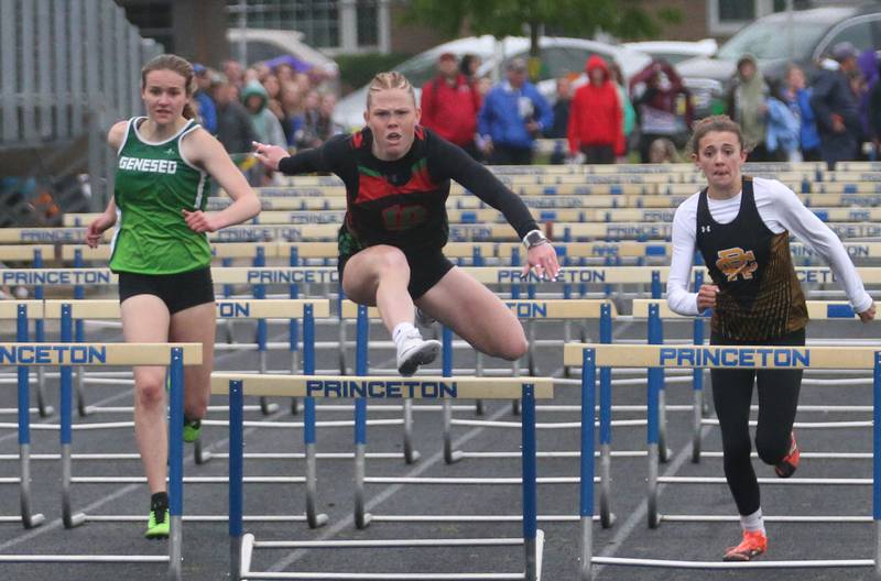 L-P's Elli Sines (center) competes in the 100 meter hurdles during the Class 2A girls track and field Sectional on Thursday, May 9, 2024 in Princeton.