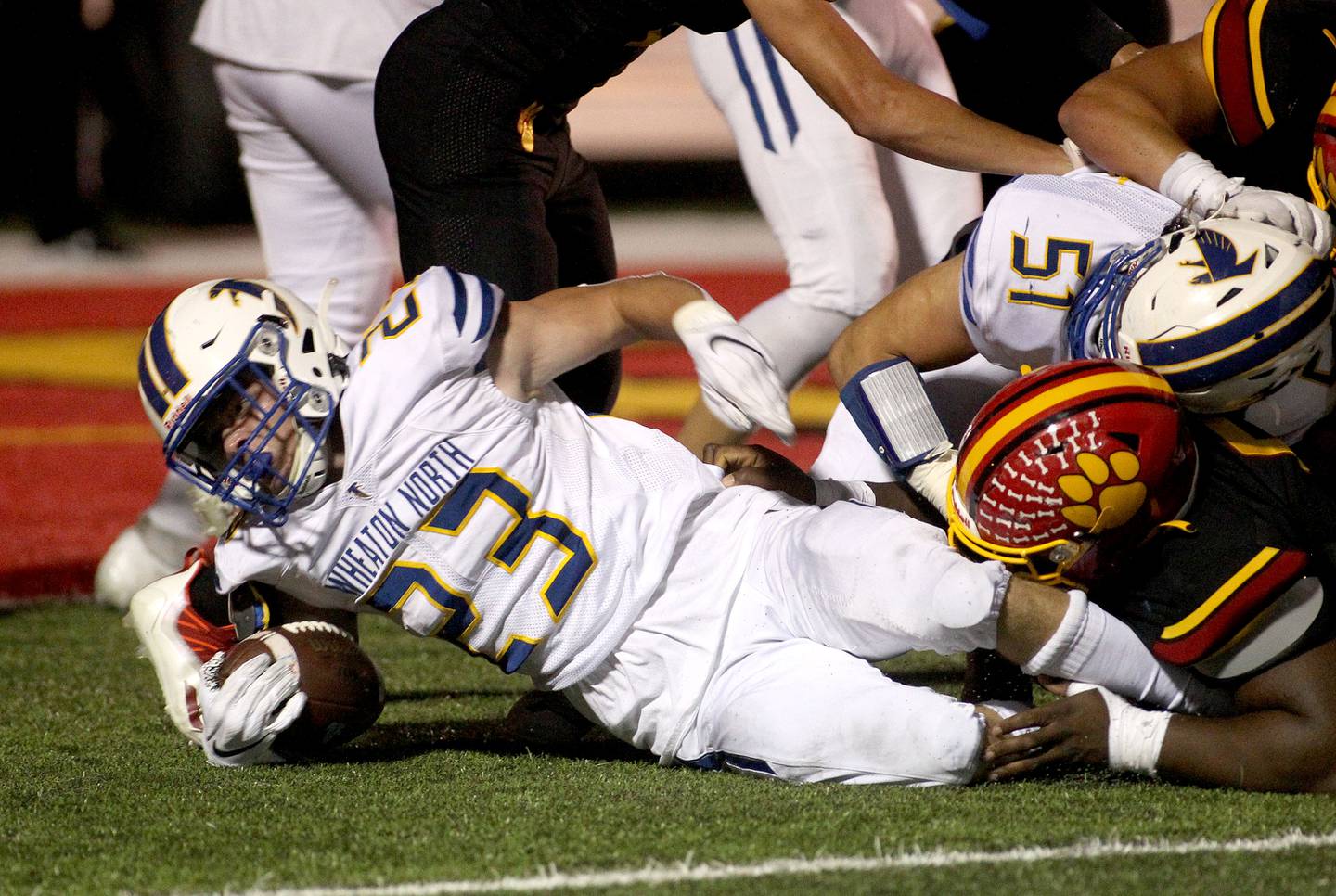 Wheaton North's Brayton Masks (23) holds onto the ball during a game at Batavia Friday, Sept. 10, 2021.