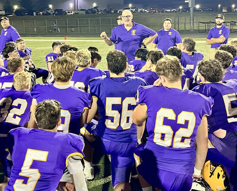 Mendota football coach Jim Eustice talks to his team after the Trojans beat Kewanee 45-13 on Friday, Oct. 3, 2025 in Mendota.