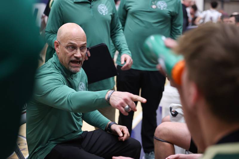 Bishop McNamara head coach Adrian Provost talks to his players in a timeout during the Fightin' Irish's 77-70 loss to Tolono Unity in the IHSA Class 2A Pontiac Supersectional on Monday, March 9, 2026.
