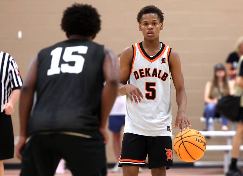 DeKalb’s Bryan Miller brings the ball up the court Friday, June 20, 2025, during their game against Streamwood in the DeKalb Live summer tournament at DeKalb High School.