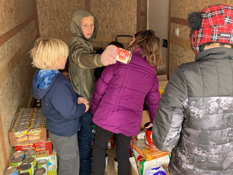 The Wonder Lake Ski Team collects food during its "Stuff the Trailer food drive in November 2021.