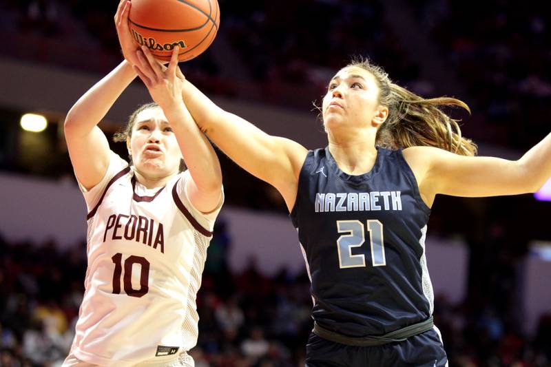 Nazareth Academy's Olivia Austin (right) goes for a rebound against Peoria's Denali Craig Edwards (left) during the Class 3A girls basketball state semifinal at Redbird Arena in Normal on Friday, March 3, 2023.