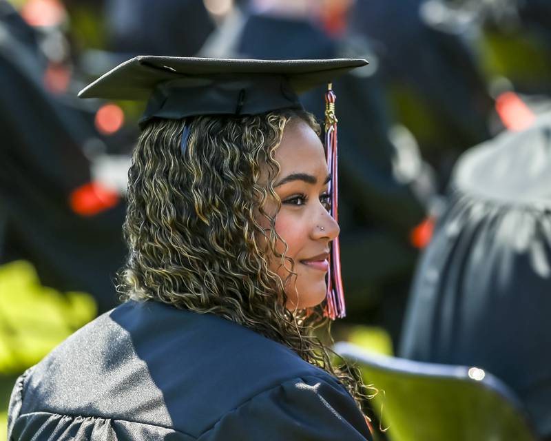 A student looks at her family in the stands during the Sandwich High School Graduation ceremony Sunday, May 18, 2025  in Sandwich.