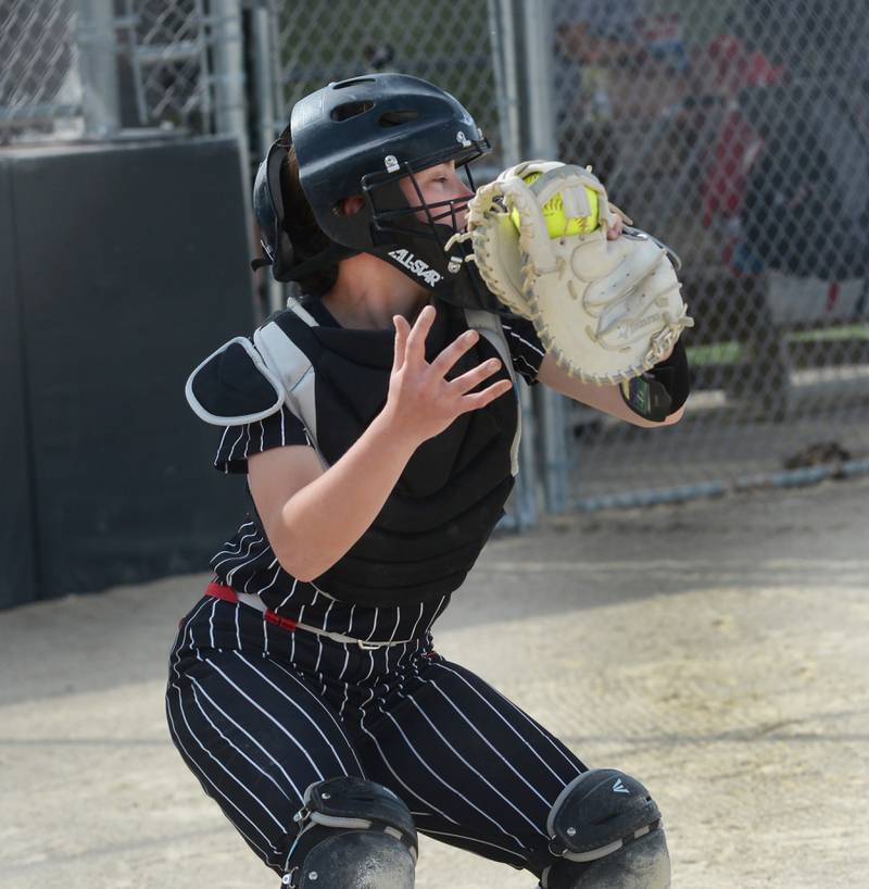 Forreston catcher Maddie Chesnek catches a pitch and looks the runner back to second base during a Monday, May 12, 2025 game with Lena-Winslow at Forreston High School.