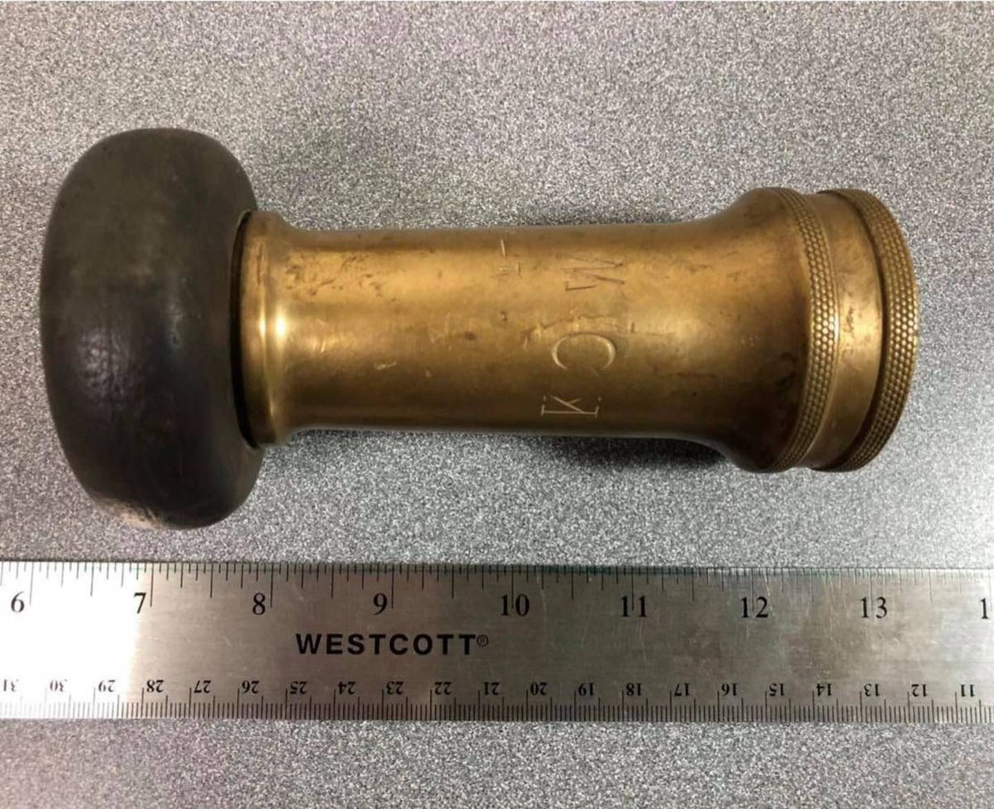 This Fire hose nozzle was donated to Midewin National Tallgrass Prairie by a former Elwood volunteer fireman. The “KOW” for Kankakee Ordnance Works says it was originally part of the firefighting equipment on the explosives manufacturing plant on the west side of Route 53. The donor told Midewin that the firefighter on the plant would donate their "old stuff" to the Elwood volunteer firefighters when theirs were replaced or upgraded. In October 1945, when the plant closed after World War II, it was redesignated the Joliet Arsenal," which suggests that this piece is from the World War II era. However, Wheeler said added that, "like anything else, it takes a while for everything to get changed over and I wouldn’t doubt that this remained in use after World War II."