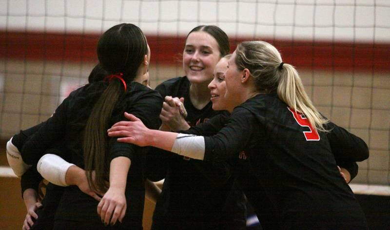 Huntley’s Red Raiders celebrate a two-set win over Burlington Central in varsity volleyball at Huntley High School in Huntley on Thursday, Oct. 24, 2024.
