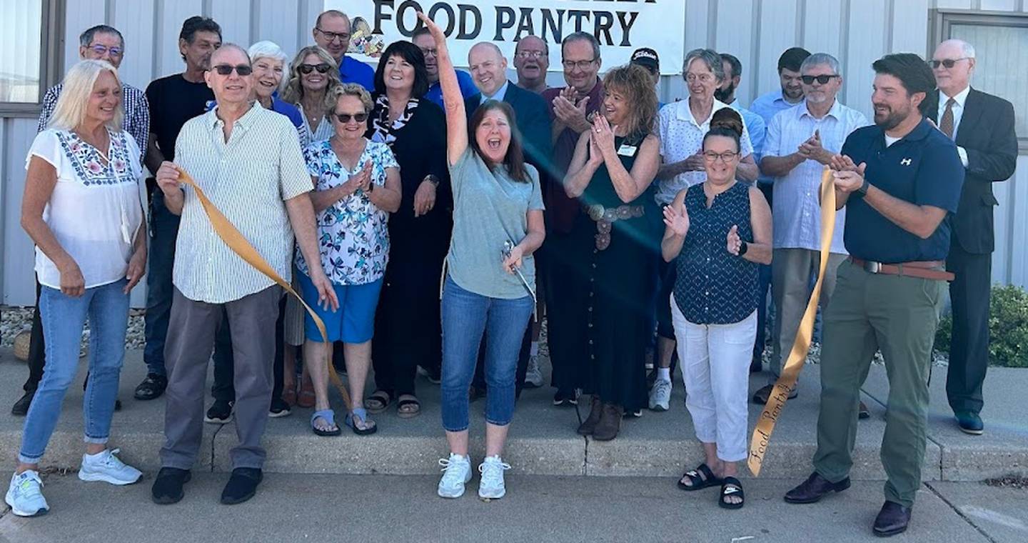 The Illinois Valley Food Pantry celebrating its new location opening with a ribbon-cutting