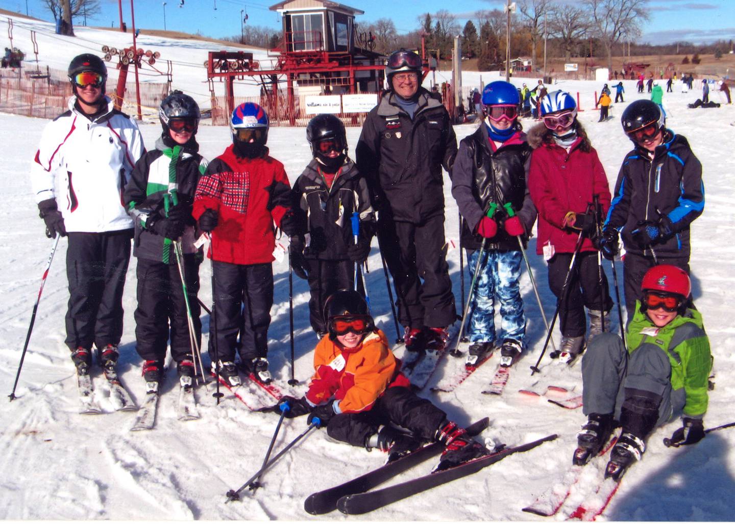 Chuck Roberts of Rochelle poses for a photo with a class of skiing students.
