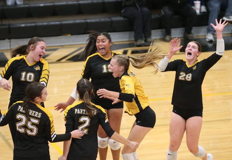 Members of the Putnam County girls volleyball team (from left) Myah Richardson, Alyvia Wachowiak, Ella Pyszka, Briitney Trinidad, Sara Wiesbrock and Kennedy Holocker react after upsetting Henry-Senachwine during the Class 1A Regional semifinal game on Wednesday, Oct. 29, 2025 at Putnam County High School.