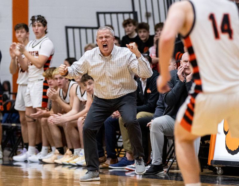 Wheaton Warrenville South Head Coach Mike Healy yells to his team during a game against Geneva High School on Tuesday, Dec. 3, 2024.