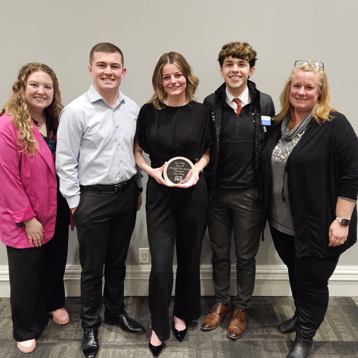 The inaugural Sauk Valley Under 40 Emerging Leader Award was presented Thursday to Gracie Young (center) of Sauk Valley Bank.